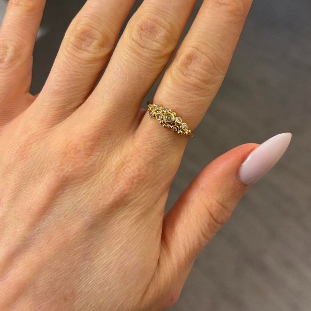 The Nicolina Sz 7 Gold plated CZ ring with round pendants sz 7 cluster stones